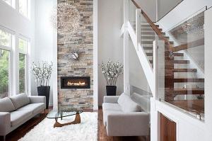 Modern-fireplace-with-sunburst-clock-overhead                                